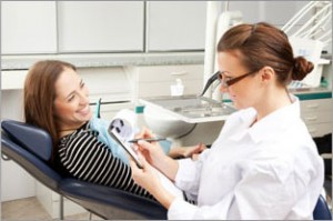 A dental professional treating a patient